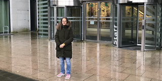 Prof. Madeo in front of building